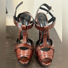 40.5 Italian Size, About A 9.5-10us New Never Worn. About 4.5 Inch Heel With Platform. Casadei Very Narrow. Will Fit A Size 9. Brown T-strap Heels For Party, Luxury T-strap Heels For Party, Chic Brown T-strap Heels, Designer T-strap Leather Heels, Leather T-strap Heels For Party, Designer T-strap Heels For Evening, Designer T-strap Heels For Party, Designer Heels With Deep Heel Cup For Night Out, Formal T-strap Heels With Branded Heel Counter