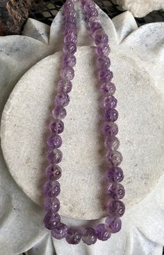 Beautiful Circa 1930s Old Chinese Carved Amethyst Shou Bead Vintage Necklace Beads are slightly graduated in size measures a little over 18 inches around weighs 77 grams of Gemstone Lavender Single Strand Round Bead Jewelry, Lavender Single Strand Jewelry With Round Beads, Purple Hand-strung Necklaces, Faceted Amethyst Round Bead Crystal Necklaces, Vintage Purple Round Beads Jewelry, Vintage Purple Round Bead Jewelry, Purple Amethyst Round Beads, Amethyst Gemstone Beaded Necklaces, Amethyst Crystal Necklaces With Polished Round Beads