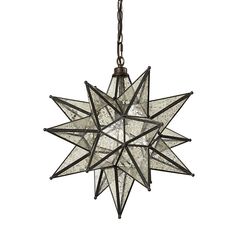 a moravian star light hanging from a chain