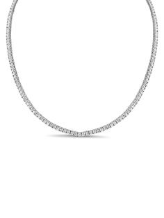 Shine bright with our Classic CZ Tennis Necklace, offering the look of an 8 ctw diamond tennis necklace without the high price tag. This timeless piece features sparkling CZ stones in a classic prong setting, delivering the elegance and brilliance of real diamonds. Perfect for any occasion, this necklace adds instant glamour and sophistication to your jewelry collection. Dazzling Diamond White Round Cut Tennis Necklace, Timeless Tennis Necklace With Brilliant Cut Cubic Zirconia, Fine Jewelry Tennis Necklace With Sparkling Stones, Timeless Cubic Zirconia Tennis Necklace With Prong Setting, Timeless Diamond White Tennis Necklace With Prong Setting, Timeless Brilliant Cut Diamond White Tennis Necklace, Dazzling Brilliant Cut White Gold Tennis Necklace, Classic Tennis Necklace In Diamond White Cubic Zirconia, Timeless Tennis Necklace With Diamond Accents In Diamond White