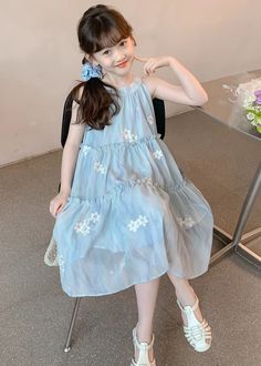 This charming Girls Dress features a Cute Blue Ruffled Button Print made from high-quality Chiffon for a chic and comfortable Sleeveless design.Fabric: ChiffonSize & Fit:Fit: This garment fits true to size.Length: Size 140 measures 75cm from shoulder to hemBust:The bust size for size 140 measures around 72cmWash: Hand Wash Cold. Blue Sleeveless Dress For Beach, Sleeveless Ruffled Dress For Summer Dress-up, Summer Sleeveless Dress With Ruffles For Dress-up, Casual Sleeveless Summer Dress For Dress-up, Sleeveless Sundress For Spring Dress-up, Light Blue Sleeveless Ruffle Dress For Spring, Light Blue Sleeveless Dress For Dress-up Occasions, Spring Light Blue Sleeveless Dress With Ruffles, Light Blue Sleeveless Dress With Ruffles For Beach