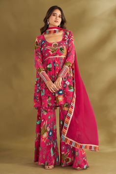 Hot pink gathered short anarkali with ikat, floral print and gold embroidery in front and sleeves. Paired with printed sharara and border printed dupatta. - Aza Fashions Semi-stitched Designer Sharara For Navratri, Designer Semi-stitched Sharara For Navratri, Bollywood Designer Wear Sharara For Diwali, Anarkali Georgette Sharara With Straight Kurta, Bollywood Georgette Sharara For Transitional Season, Pink Dabka Sharara For Festivals, Semi-stitched Chinon Bollywood Palazzo Set, Traditional Georgette Palazzo Set For Navratri, Festival Pink Sharara With Dabka Details