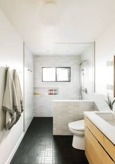 a bathroom with black and white tile flooring