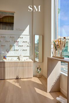 the sun shines through an open window in a jewelry store