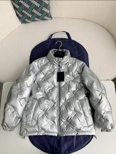 Indulge in the luxurious warmth and iconic style of our Glossy Puffer Jacket, capturing the essence of Louis Vuitton Design. Its lustrous diamond-quilted design and flattering silhouette will keep you cozy and effortlessly chic all season. This is a high quality replica. Luxury Quilted Puffer Jacket, Luxury Quilted Puffer Jacket For Fall, Luxury Quilted Long Sleeve Outerwear, Luxury Long-sleeve Quilted Outerwear, Luxury Quilted Puffer Jacket For Winter, Luxury Quilted Puffer Jacket With Long Sleeves, Luxury Quilted Long Sleeve Puffer Jacket, Luxury Long Sleeve Quilted Down Jacket, Luxury Puffer Outerwear