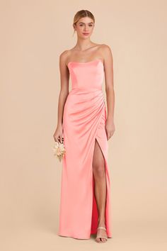 a bridesmaid in an orange strapless dress with a slit down the side