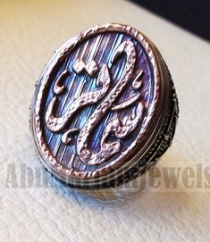 Customized Arabic calligraphy names ring personalized antique jewelry style sterling silver 925 and bronze all size TSB1005 خاتم اسم تفصيل This is made to order item please allow 2 - 3 weeks before shipping . Any name can be applied one or two parts . Please write the name/s in the order notes in Arabic or English . A sketch drawing ( see pics ) will be sent to you after 2 - 5 days from order before we proceed to production . Ring face dimensions 21 mm X 16 mm Name on the sample Samater سماتر . Silver Nameplate Rings As Gifts, Personalized Silver Nameplate Ring, Arabic Letter Jewelry, Arabic Calligraphy Names, Nickles Jewelry Name Arabic, Calligraphy Names, Face Dimensions, Calligraphy Name, Name Rings