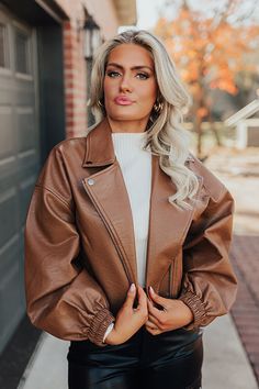 Add an edgy touch to your fall wardrobe with our chic chocolate colored 'Koty' jacket featuring faux leather material, a zip closure front with a collared neckline, long loose sleeves with elastic fitted cuffs, a single accent chest pocket cut and two low pockets, and a trendy bomber silhouette that ends in a straight hemline! Measurements S : Bust 38", Hip 34", Length 19.5", Sleeve Length 20", Waist 36". M : Bust 40", Hip 36", Length 20", Sleeve Length 20.5", Waist 38". L : Bust 42", Hip 38", L Brown Leather Jacket With Zipper For Fall, Trendy Brown Faux Leather Biker Jacket, Brown Faux Leather Jacket For Fall, Chic Brown Outerwear With Zipper, Chic Brown Outerwear With Zipper Closure, Trendy Brown Faux Leather Outerwear, Brown Faux Leather Outerwear For Fall, Fall Brown Faux Leather Outerwear, Faux Leather Jacket For Fall