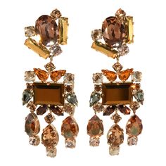 This is part of Chairish’s Costume Jewelry assortment.  Elegant statement style clip earrings made in France with high quality rhinestones in varying shapes. Colors include brown, champagne, copper, gold, and gray. Metal is gold plated. We believe this pair dates to the very early 2000s. Marked P. Ferrandis on the clip backs. These beautiful chandelier earrings measure a little over 3 1/4" long and 1 1/4" wide. Condition is excellent for this type of earring with only minor wear to the plating o Bhavya Ramesh, French Chandelier, Statement Chandeliers, Types Of Earrings, Beautiful Chandelier, Accessories Jewelry Earrings, Early 2000s, Clip Earrings, Chandelier Earrings