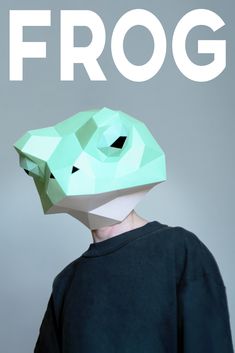 a person with a paper mask on their head and the words frog written in white