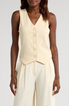 A fitted vest cut from a linen-kissed fabric is rendered in a neutral hue and ready to be worn as an outer layer or a sassy solo player. Front button closure V-neck Lined 89% polyester, 8% linen, 3% elastane Dry clean Imported Fitted Linen Tank Top For Spring, Beige Cotton Vest With Button Closure, Elegant Linen Vest Tops, Elegant Linen Tank Top For Spring, Tailored Linen Spring Vest, Fitted Sleeveless Linen Vest, Chic Fitted Linen Tank Top, Tailored Linen Vest For Spring, Fitted Linen Tops With Buttons