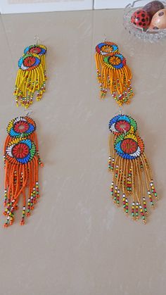 Wholesale African earrings, Beaded earrings, Boho earring, Elegant assorted earrings, Zulu earring, Gift for her, Tribal earring The listing is for ALL 12 pieces . These Zulu beaded earrings are superbly crafted which can be worn with any outfit at different occasions and they will absolutely make you stand out. These colorful earrings are very light to wear. Selecting one quantity means that you receive the 14 pairs. If you want to rule out some colors and replace them with others of your choic Traditional Beaded Earrings With Round Beads, Traditional Multicolor Earrings With Colorful Beads, Traditional Multicolor Beaded Earrings, Traditional Chandelier Earrings With Round Beads, Multicolor Round Beads Earrings For Festivals, Beaded Dangle Danglers For Festivals, Traditional Beaded Dangle Earrings, Unique Round Beads Earrings For Festivals, Festival Beaded Dangle Earrings