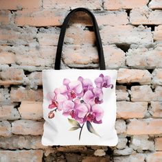 "This Beautiful Watercolor Orchid Tote Bag will make a perfect gift for yourself or any flower lover you know. The vibrant watercolor colors of the flowers make this bag match any outfit for everyday use. Perfect for all ages. It is made from durable lasting materials. - Made with 100% polyester, a medium-weight fabric that is Extremely strong, highly durable, and perfect for everyday use. - All tote bags come with a non-woven laminate inside - Black cotton handles - reinforced second row of sti Multicolor Floral Print Bag For Gift, Purple Floral Print Bag For Everyday Use, Everyday Purple Bag With Floral Print, Gift Multicolor Floral Print Shoulder Bag, White Floral Print Bags As Gifts, White Floral Print Flower Shaped Shoulder Bag, White Floral Print Flower-shaped Shoulder Bag, White Botanical Rectangular Bag, Pink Flower-shaped Shoulder Bag As A Gift