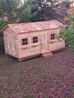 cedar shed with double door entry, single door entry and windows with window boxes Kayak Shed, Motorcycle Storage Shed, Canoe Storage, Cedar Shed, Wooden Storage Sheds, Storage Shed Kits, Motorcycle Storage, Diy Storage Shed, Boat Shed