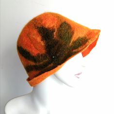 Wool Merino 18microne,Margilan silk diameter:61cm  The hat is personally made by me using the technique of wet felting .... only soap, warm water and desire ... It is a perfect addition to your outfit on cold days. It will warm you and complement your image! Handmade Cloche Hat With Curved Brim For Winter, Orange Winter Hat With Short Brim, Winter Orange Hat With Short Brim, Orange Wide Brim Hat For Winter, Orange Wide Brim Winter Hat, Handmade Winter Felt Hat, One Size, Handmade Winter Felt Hat In One Size, Handmade Winter Felt Hat, Handmade Winter Felt Hat With Curved Brim