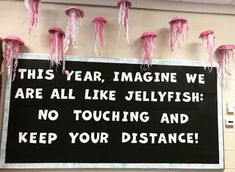 a sign that says, this year imagine we are all like jellyfish no touching and keep your distance