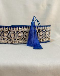 Embroidered obi belt with tassels, handmade in Paris using embroidered indian laces sourced in the mythic city of Jaipur. They are the perfect accessory to transform any boring dress in a boho statement piece.  We love it's exotic & vintage look and we are sure you will love it too!  HOW TO CLOSE THE BELT:  The belt features satin straps with tassels at the end that you can tie around your waist to show the tassels on the front or at the back.  MATERIALS: The belts are lined with a linen or cott Tassels Handmade, Dark Blue Velvet, Polycotton Fabric, Obi Belt, Unique Accessories, Suspender Belt, Boho Bag, Flower Embroidery, Product Pictures