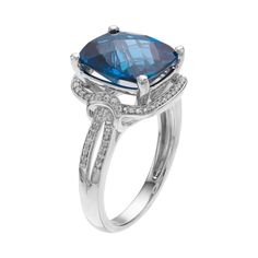 Designed with a cushion-cut genuine London blue topaz center stone encompassed with lab-created white sapphires, this halo ring is sure to garner compliments. RING DETAILS Width: 0.51 in. Metal: sterling silver Plating: rhodium Finish: polished Packaging: boxed STONE DETAILS Stone type: London blue topaz, lab-created white sapphire Total weight: 5 1/10 ct. Center stone weight: 4 3/4 ct. Center stone size: 12 mm x 10 mm Shape: cushion cut, round Setting: prong Gemstones may have been treated to e Cushion Cut Topaz Ring With Diamond Accents, Blue Topaz Cushion Cut Diamond Ring, Blue Topaz Cushion Cut Ring With Halo Setting, Cushion Cut Blue Topaz Rings With Diamond Accents, Cushion Cut Blue Topaz Ring With Halo Setting, Fine Jewelry Cushion Cut Topaz Ring With Center Stone, White Gold Topaz Ring With Halo Setting, Cushion Cut, Cushion Cut White Gold Topaz Ring With Halo Setting, Cushion Cut Topaz Ring Fine Jewelry