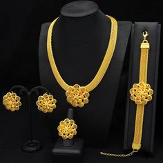 Indulge in luxury with this exquisite Necklace Set, perfect for wedding parties. With its opulent design and superior craftsmanship, this set features a necklace, bracelet, earrings, and ring. Make a lasting impression and elevate your style with this luxurious jewelry set." Elegant Gold Round Bridal Sets, Fine Jewelry Gold-plated Wedding Jewelry Sets, Gold Plated Fine Jewelry Sets For Wedding, Fine Gold Plated Jewelry Sets For Wedding, Elegant Gold Plated Jewelry Sets For Wedding, Elegant Gold Plated Round Bridal Sets, Elegant Gold Plated Bridal Sets For Formal Occasions, Elegant Metal Bridal Sets For Formal Occasions, Elegant Formal Metal Bridal Sets