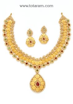 22 Karat Gold 'Lakshmi Kasu' Necklace & Drop Earrings Set with Uncut Diamonds , Rubies & Emeralds 
   - 235-DS670 - in 69.450 Grams for USD $9043.51. 
Made in India by Totaram Jewelers Online this product is in Gold - 22 Karat BIS Hallmark 916 KDM Gold  & is an excellent gift for Adult - Women. Ships fully insured with secured guaranteed delivery for free with your order over $250 from New Jersey USA & comes with 30 days exchange policy. Gold Necklace Set Kameswari Jewellers, 22k Gold Necklace Addiga, Short Gold Necklace Kameswari Jewellers, 22k Gold Necklace Kameswari Jewellers, Luxury 22k Gold Jewelry Sets For Gift, Luxury 22k Gold Jewelry Sets As Gift, Necklace Online Kameswari Jewellers, Buy Necklace Kameswari Jewellers, Kasu Necklace