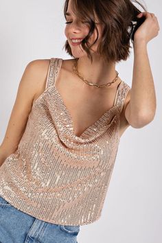 Our Champagne & Sequins Cowl Neck Top has thick straps to help you keep your cool while dancing the night away! Equally great looking with jeans or black leather skirt! Fabric Contents: 100% Polyester Gold Sequin Top, Cowl Neck Shirt, Black Leather Skirt, Skirt Fabric, Black Leather Skirts, Cowl Neck Top, Gold Top, Gold Sequins, Gold Sequin