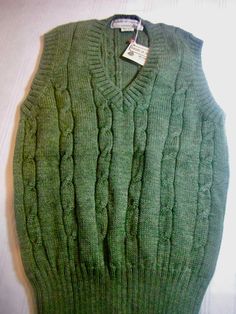 Vintage Tricots St. Raphael 100% pure wool, made in Uruguay, green, v-neck, never worn. Measurements Chest 36 Length 25 in. Classic Wool V-neck Sweater Vest, Green V-neck Knitted Sweater, Classic Green Wool Sweater, Classic Green Knitted Sweater, Fitted Green Merino Wool Sweater, Casual Green Knitted V-neck Sweater, Classic Green Cable Knit Sweater, Knitted Wool V-neck Tops, Wool Knitted V-neck Top