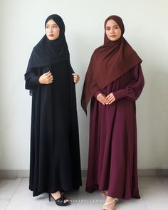 Elegant day to night abaya featuring bishop sleeves with wrap button cuffs complete with invisible side pockets. Made for the long haul, this abaya comes with a sleeveless underdress and matching hijab. FABRICATION 100% Polyester Hijab: Chiffon Hand Wash Cold Delicate Separately COLOR Jet Black, Burgundy SIZE AND FIT Model wears size S Model: 165cm/5'5 PRODUCT DETAILS Centre front eye-hook closure  Shipping from Indonesia If you have any questions, please send us a message in Etsy conversations. Long Niqab With Dabka For Eid, Long Dabka Niqab For Eid, Traditional Long Niqab For Eid, Long Niqab For Eid, Black Long Sleeve Khimar With Dabka, Solid Long Thobe For Eid, Long Thobe For Eid, Solid Long Niqab For Eid, Long Solid Niqab For Eid