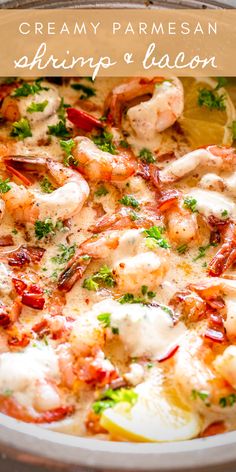 a pan filled with shrimp and sauce on top of a table