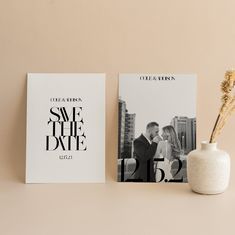 a couple's save the date card next to a vase