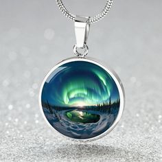 Embrace the mystique of the wilderness with our Personalized Aurora Wilderness Lovers Necklace.  This Personalized Aurora Wilderness Lovers Necklace will make a great gift for her; be it Christmas, Valentine's, Mother's Day, a Birthday, Anniversary, or as a memento to mark a trip to Alaska, Iceland, Sweden, wherever your aurora hunting journey took you, or will take you. Maybe your loved one dreams of seeing the northern lights right here in the Lower 48 as has been happening recently, or is an Aurora Borealis Jewelry, Trip To Alaska, Light Jewelry, Lovers Necklace, Engraved Pendant, See The Northern Lights, Alaska Travel, Luxury Necklace, Engraved Necklace