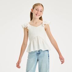 Refresh your child's summer closet with this Sleeveless Smocked Woven Top from art class™. Made from cotton dobby fabric, this fitted woven top offers them all-day comfort, while the smocked upper lends them a flattering fit. Showcasing flutter cap sleeves and a peplum waistline for a charming look, they can pair it with their favorite skirts and sandals for a cute, dressed-up look. art class™: One-of-a-kind looks for the one and only you. Dobby Fabric, School List, Summer Closet, Cute Preppy Outfits, Top Art, School Shopping, Kids Outfits Girls, Woven Top