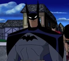 batman and batgirl walking down the street in front of a house with two women