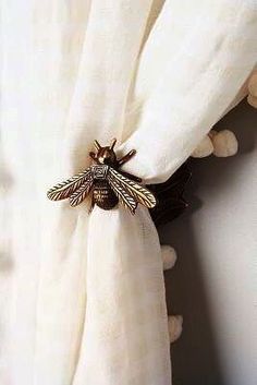 a close up of a napkin with a bee on it