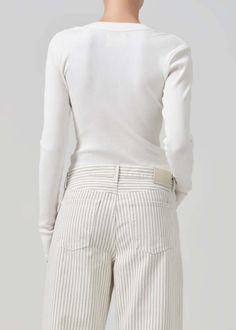 Description:  designed from a form-fitting rib this versatile henley can be worn fully buttoned or undone for a more relaxed look.    looks like: light off white    fabric:  49% organic cotton 49% tencel lyocell 2% spandex    feels like:  ultra-soft ultra-supportive organic cotton rib with a hint of stretch that holds the body    machine wash cold inside out with like colours.  do not bleach.  tumble dry low.    made in the usa with imported materials    measurements:  this fits true to size    body length: 21 1/2"  shoulder to shoulder: 13"  sleeve length: 24 1/2"    model is 5'10" and wearing a size small Rails Clothing, Swim Brands, Retro Brand, Mother Denim, Henley Top, Citizens Of Humanity, Knit Skirt, Knit Jacket, Jean Coat