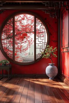 a large round window sitting above a wooden floor next to a vase with a plant in it