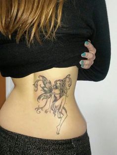 a woman with a tattoo on her stomach