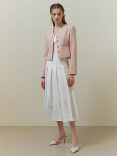 This piece of clothing is a textured jacket featuring a notched lapel and a three-button closure. This piece of clothing is a textured jacket featuring a notched lapel and a three-button closure. It is tailored with a structured fit and includes two patch pockets on the front. The sleeves are full-length, and the overall design exudes a formal yet contemporary aesthetic.- The jacket presents a sophisticated appearance with its notched lapels and button details.- Patch pockets add both function and a casual touch to the otherwise formal item.- Its textured fabric contributes to a rich, tactile experience and visual depth. Chic Spring Tweed Jacket Single Breasted, Chic Single-breasted Tweed Jacket For Spring, Spring Elegant Tweed Jacket With Suit Collar, Chic Spring Single-breasted Tweed Jacket, Elegant Spring Tweed Jacket With Suit Collar, Semi-formal Spring Tweed Jacket With Pockets, Spring Semi-formal Tweed Jacket With Pockets, Structured Spring Semi-formal Blazer, Spring Semi-formal Structured Blazer