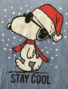 a blue shirt with a cartoon dog wearing a santa hat