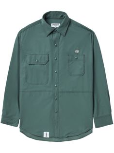 avocado green stretch-design classic collar long sleeves with press-stud fastening cuffs logo patch at the chest two stud-fastening chest pockets curved hem front button fastening Long Sleeve Shirt With Snap Buttons For Streetwear, Green Long Sleeve Tops With Patch Pockets, Green Work Shirt With Patch Pockets, Green Button-up Shirt For Streetwear, Green Button-up Shirt With Patch Pockets, Casual Long Sleeve Outerwear With Logo Patch, Green Buttoned Tops For Streetwear, Avocado Green, Green And Brown