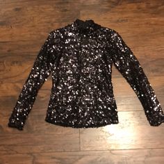 This Is A Black Sequin Long Sleeve Top With Mock Neck, And Zipper At Upper Back. Perfect Party Top! Glamorous Winter Tops For Night Out, Sequined Tops For Evening Winter Events, Fitted Glamorous Black Top, Sequin Tops For Winter Night Out, Winter Sequined Tops For Night Out, Sequin Tops For Night Out In Winter, Black Tops For Night Out Party Season, Black Tops For Party Season Night Out, Black Tops For Party Season And Night Out