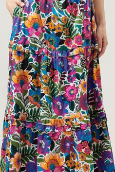 A little artsy floral action never hurt anyone. Complementary flower motifs work together to create the Santa Elena print. It decorates a tiered maxi skirt with ruffle trim. An elastic waist tops a flowy fit with side pockets. Wear it with a solid tank and sandals for an effortless, boho look.- Elastic waist- Pockets- Ruffle trim- Flowy fit- Color: Floral MultiSize + Fit - Model is 5'9" and wearing size S- Measurements taken from size S - Waist: 13 3/4"- Length: 38" Fabric Self: 100% Cotton Styl Flowy Ruffled Maxi Skirt For Garden Party, Spring Floral Print Tiered Maxi Skirt, Flowy Tiered Floral Print Maxi Skirt, Casual Tiered Maxi Skirt With Floral Print, Garden Party Ruffled Maxi Skirt, Spring Floral Patchwork Maxi Skirt, Tiered Multicolor Floral Print Maxi Dress, Tiered Skirt With Floral Print For Garden Party, Casual Multicolor Tiered Maxi Dress