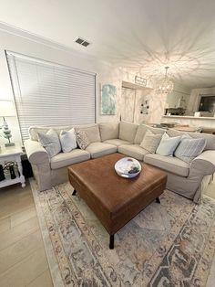 a living room filled with furniture and a large rug