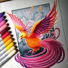 a drawing with colored pencils next to it