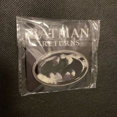 the batman returns movie poster is wrapped in plastic