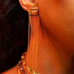 Our Gold & Tassels give DRAMA and classy AF 👌🏾 Made with high quality 18K gold plating. Sold as a pair. Composition: Material: 18k gold plated Luxury Evening Jewelry With Tassels, Luxury Dangle Tassel Jewelry, Yellow Gold Dangle Plug Earrings Gold Plated, Yellow Gold Plated Dangle Plug Earrings, Gold Plated Yellow Gold Dangle Plug Earrings, Yellow Gold-plated Dangle Plug Earrings, Luxury Gold Single Plug Earring, Elegant Metal Jewelry With Tassels, Gold-tone Dangle Jewelry With Plating