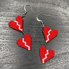 Broken Heart earrings made with beaded glass. Showed in red but can be customized to other colors.  Made by hand with love. Heart Beaded Earrings, Milwaukee Wi, Heart Beads, Geometric Earrings, Heart Earrings, Milwaukee, Beaded Earrings, Jewelry Earrings Dangle, Beaded Jewelry