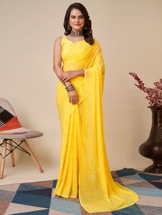 Elevate your wardrobe with our charming yellow sequins georgette haldi wear saree with blouse. This stunning saree is crafted with high-quality georgette material, featuring delicate thread embroidery and sequin work that adds a touch of elegance to the overall look. The vibrant yellow color of the saree is perfect for any festive occasion, especially haldi ceremonies.
The georgette fabric ensures a comfortable and flowy drape, making it easy to move and dance in. The matching art silk blouse co Yellow Chinon Pre-draped Saree, Yellow Georgette Pre-draped Saree With Pallu, Festive Yellow Pre-draped Saree With Mirror Work, Yellow Georgette Dupatta For Party, Unstitched Yellow Blouse Piece For Party, Yellow Bollywood Style Pre-draped Saree In Georgette, Yellow Chinon Pre-draped Saree With Traditional Drape, Yellow Bollywood Pre-draped Georgette Saree, Yellow Fitted Georgette Pre-draped Saree