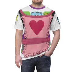 a man wearing a pink shirt with a heart on it