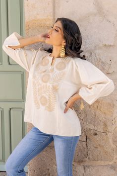 This Beautiful Mexican 3/4 length sleeve blouse is comfortable and stylish. It has beautiful Hand embroidered flowers.  Please Note: This blouse is hand embroidered and the details may vary from piece to piece. This blouse comes in one size which fits sizes Small and Medium. Spring Floral Embroidered Half Sleeve Top, Bohemian Tops With 3/4 Sleeve And Floral Embroidery, Traditional Long Sleeve Tops With Tonal Embroidery, Summer Embroidered Tops With 3/4 Sleeves, Floral Embroidered Top With 3/4 Sleeves For Spring, Spring Floral Embroidered Top With 3/4 Sleeve, Bohemian Embroidered Blouse With 3/4 Sleeves, Spring Blouse With Floral Embroidery And 3/4 Sleeves, Bohemian Half-sleeve Blouse With Floral Embroidery