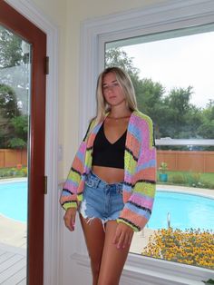 This colorful chunky knit cardigan sweater is the perfect way to stay cozy and stylish this fall and winter. Made from a soft and warm blend of wool and acrylic, it features a relaxed fit, long sleeves, and a cozy button-front closure. The bold and vibrant colors make it a fun and eye-catching addition to any outfit. Looking for a cozy and stylish sweater to keep you warm this fall and winter? Look no further than this colorful chunky knit cardigan sweater! Made from a soft and warm blend of woo Cozy Textured Knit Cardigan, Cozy Textured Knit Acrylic Cardigan, Spring Chunky Knit Acrylic Sweater Coat, Trendy Colorful Sweater For Fall, Casual Multicolor Knit Cardigan, Cozy Acrylic Yarn Sweater For Spring, Spring Cozy Sweater In Acrylic Yarn, Trendy Textured Knit Acrylic Cardigan, Multicolor Soft Knit Cardigan For Fall